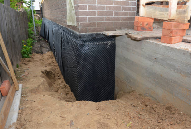 Happy homeowners after waterproofing job in Forked River
